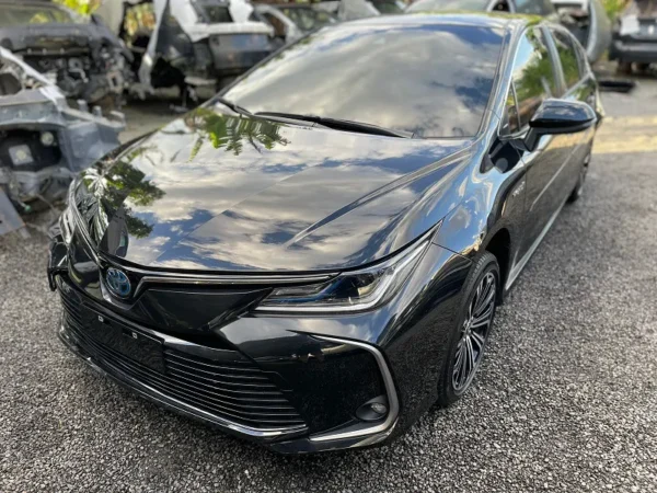 PÁRA-CHOQUE E EMBLEMA COROLLA HÍBRIDO